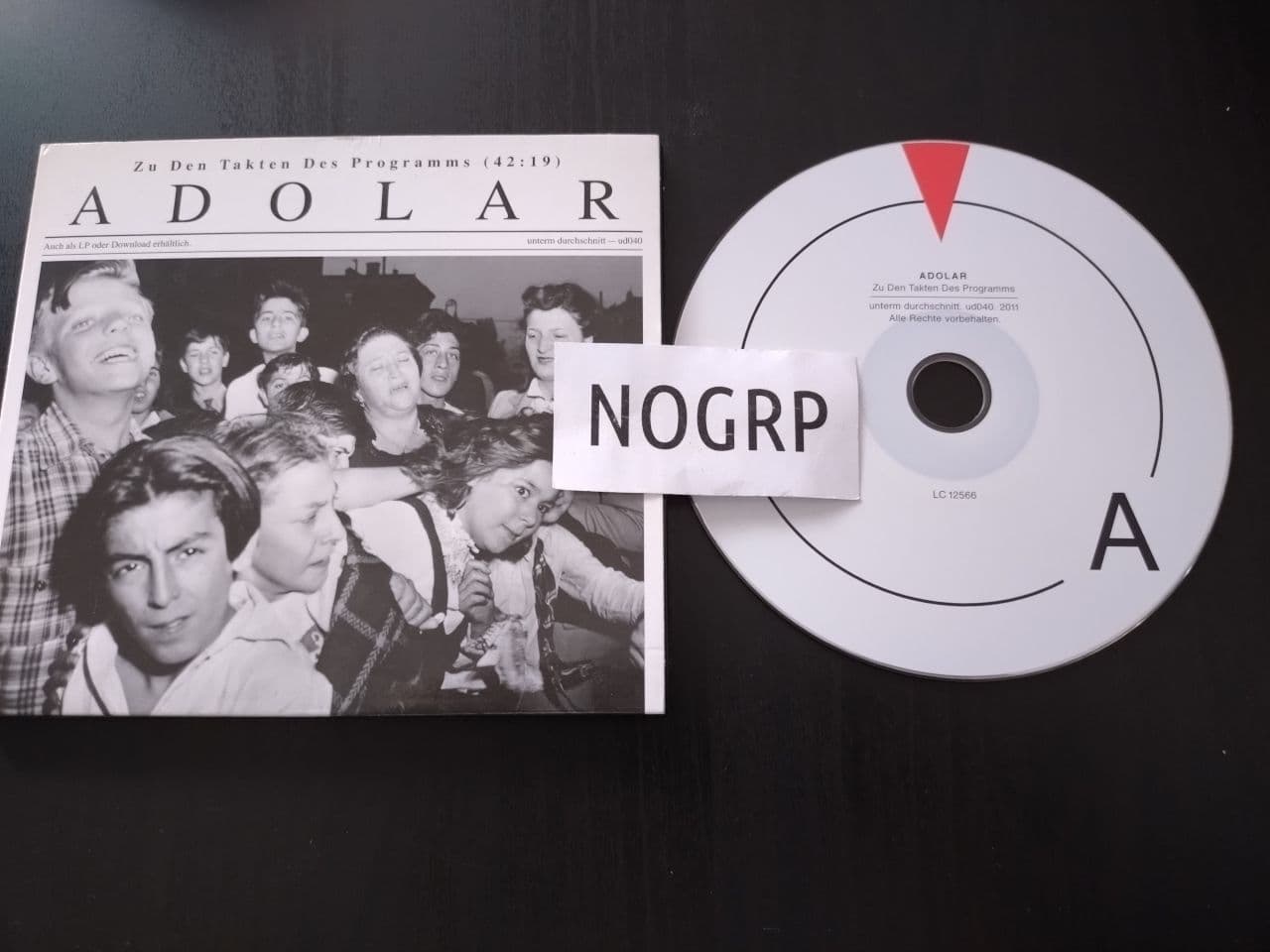 Adolar-Zu_Den_Takten_Des_Programms-_UD040_-DE-DIGIPAK-CD-FLAC-2011-NOGRP