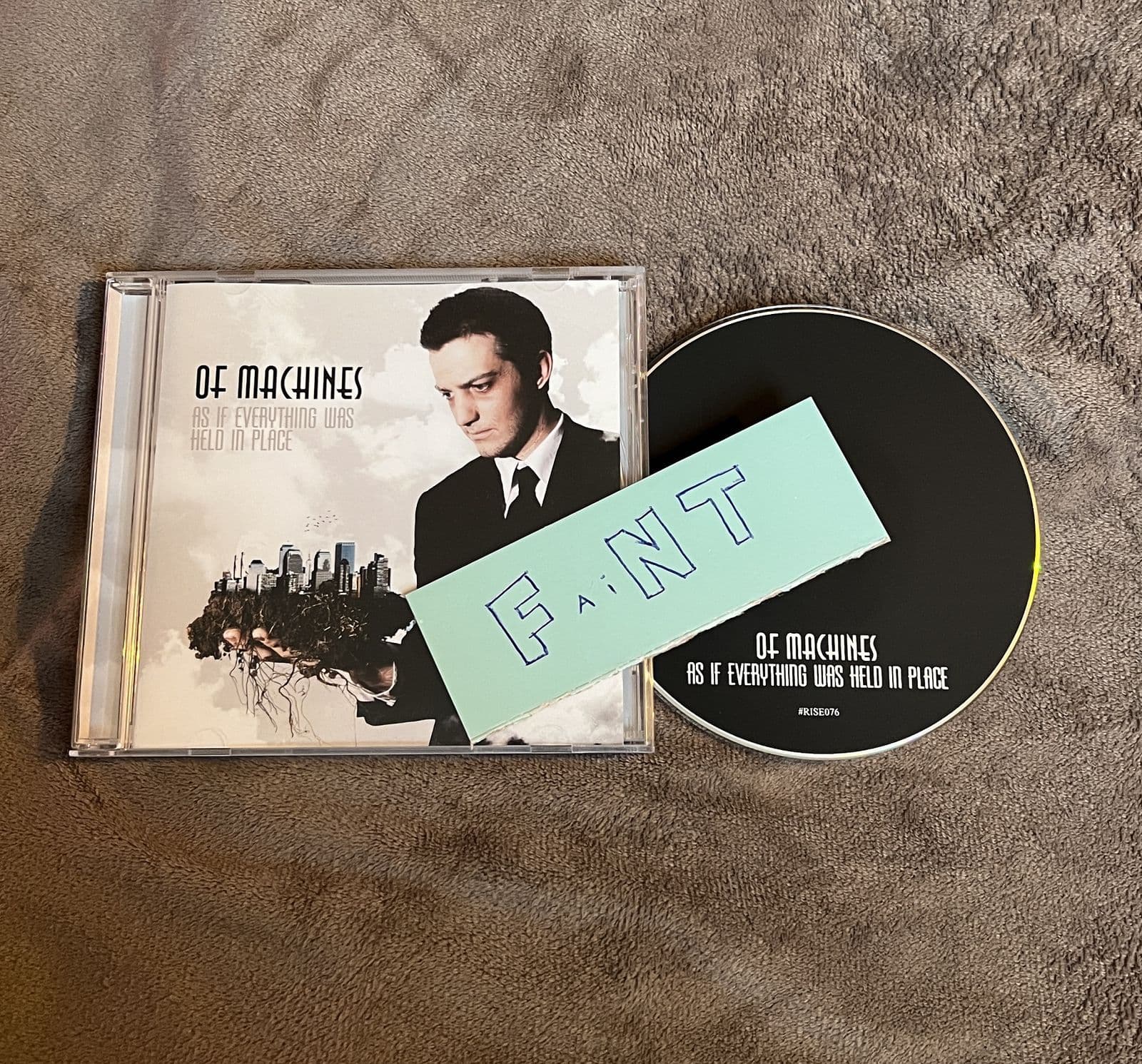 Of_Machines-As_If_Everything_Was_Held_In_Place-CD-FLAC-2009-FAiNT