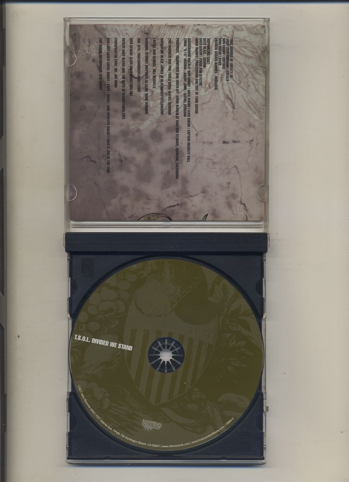 T.S.O.L.--Divided_We_Stand-CD-FLAC-2003-MEOWZiK